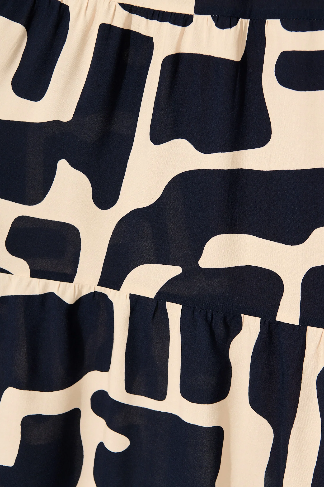 Tarah Midi Smock Dress in Black and Beige Geometric Print - Image 6
